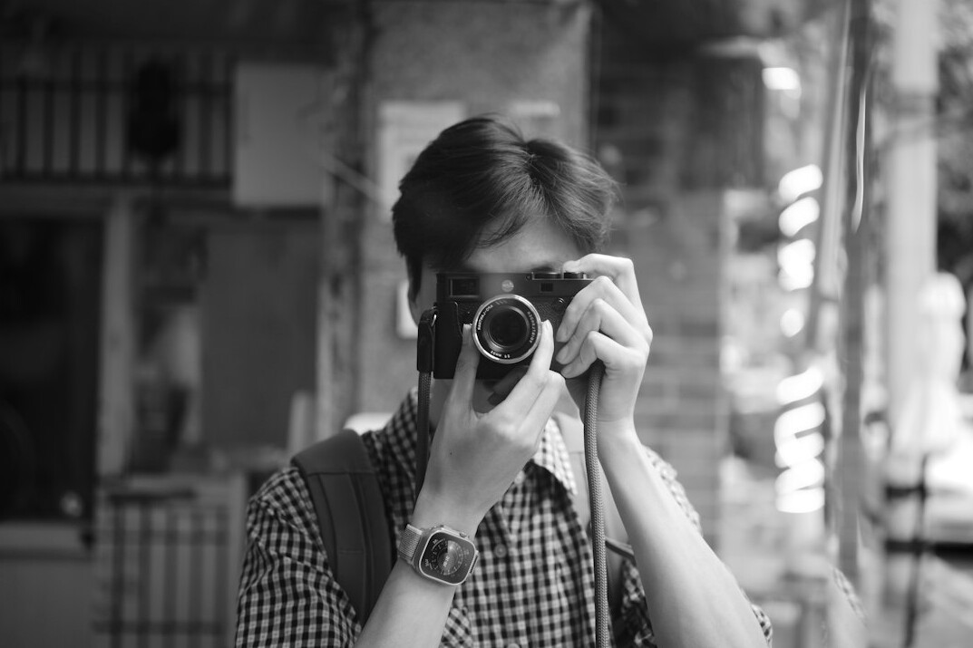 documentary photographer in street